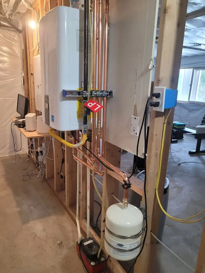 Licensed plumber repairing a kitchen sink in Somerville